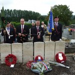 The graves of The 11 soldiers at Guise Cemetery. L-R. Ollie Griffin (President RMFA). Gerald Griffin (Piper). Adrian Foley (Bugler - Vice Chairman RMFA). Liam Nolan (Chairman RMFA).
