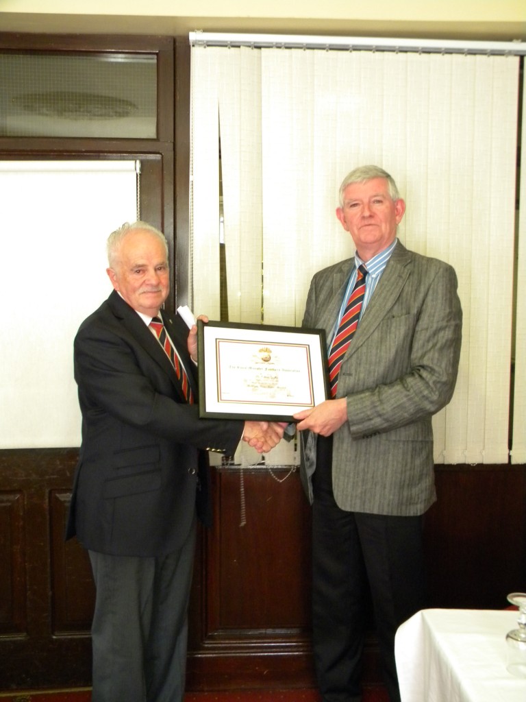 Ollie being presented with his cert